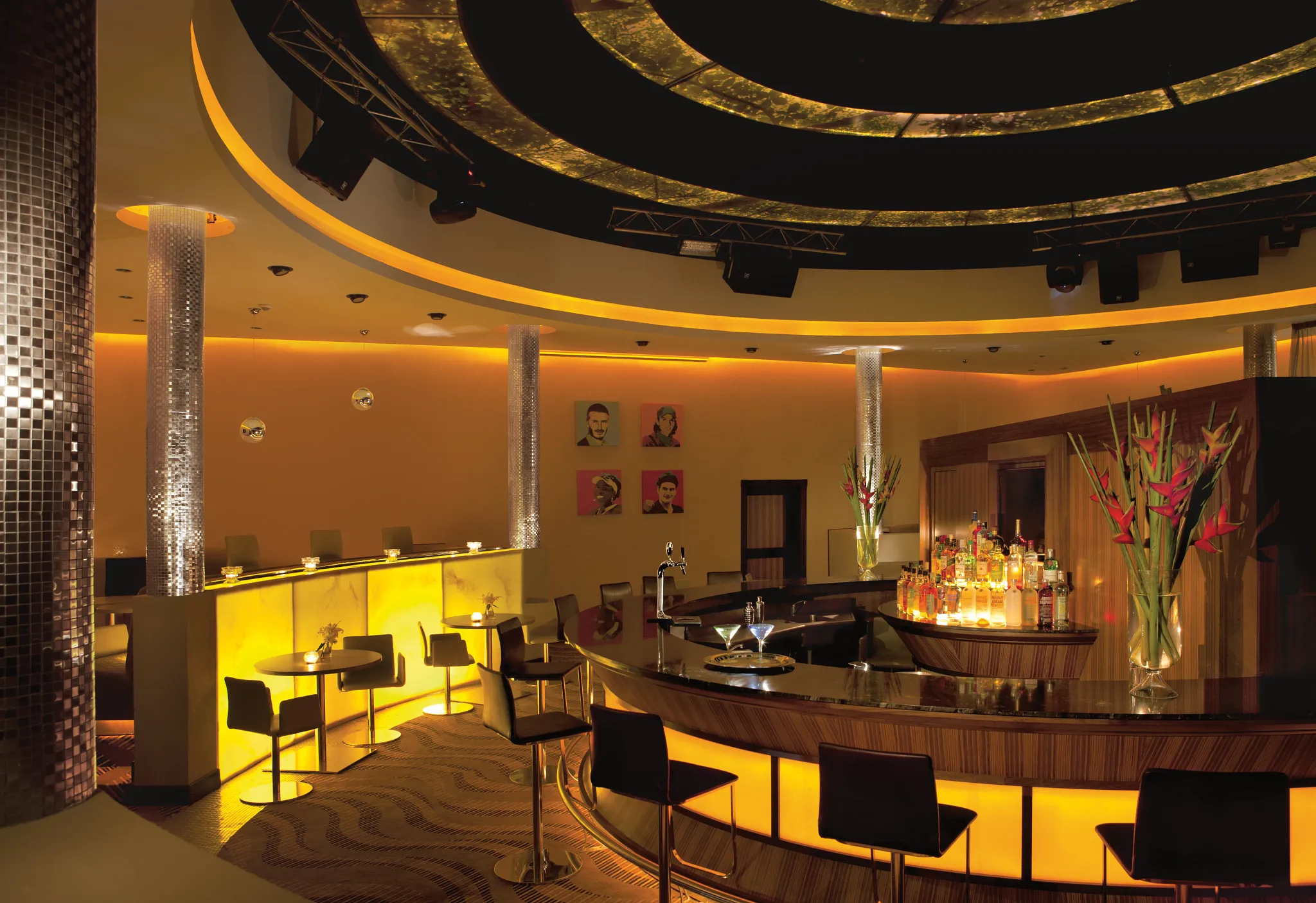 Desires Music Lounge & Sports Bar at Secrets Wild Orchid Montego Bay featuring a stylish illuminated bar, lounge seating, and vibrant nightlife atmosphere.