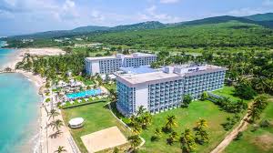 Hilton Rose Hall Resort and Spa all-inclusive family resort in Jamaica with waterpark, golf course, and beachfront pools.