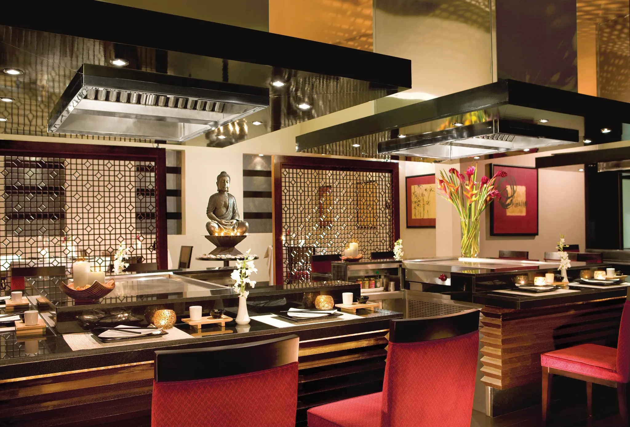 Himitsu Pan-Asian Restaurant at Secrets Wild Orchid Montego Bay featuring teppanyaki tables, elegant décor, and open-air dining ambiance.