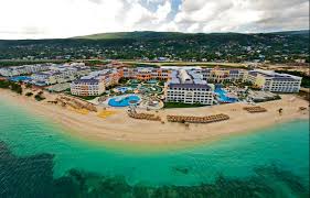 Iberostar Grand Rose Hall adults-only all-inclusive resort in Jamaica with beachfront pools, colonial architecture, and luxury amenities.