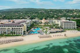 JOIA Rose Hall by Iberostar adults-only all-inclusive resort in Jamaica with modern design, beachfront pools, and elevated culinary experiences.