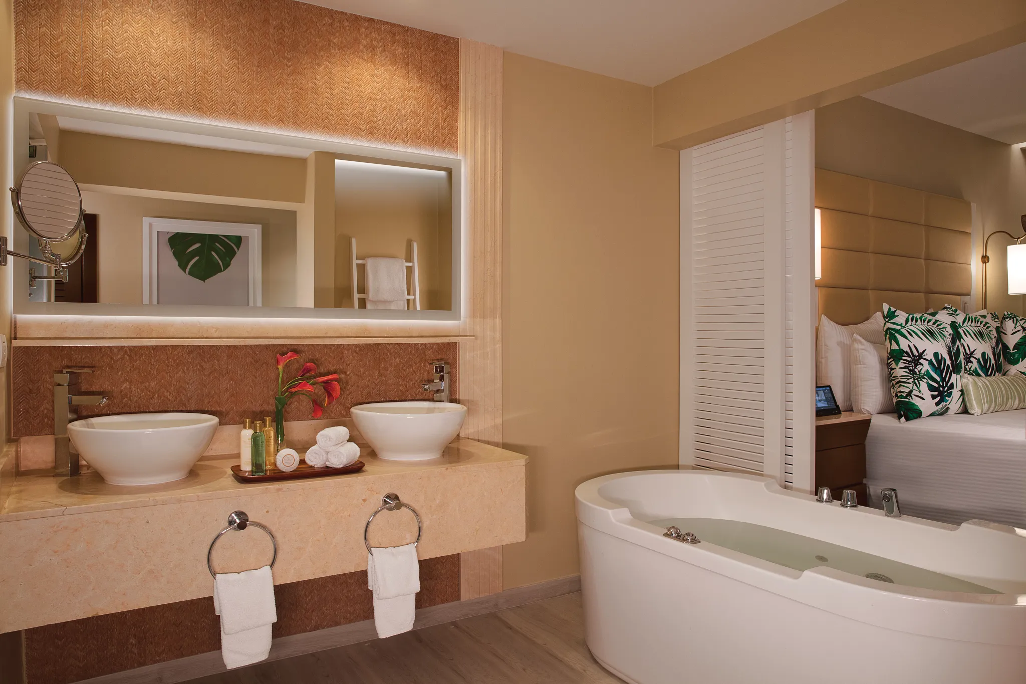 Junior Suite Ocean Front bathroom with dual sinks and in-room hot tub at Secrets Wild Orchid Montego Bay.