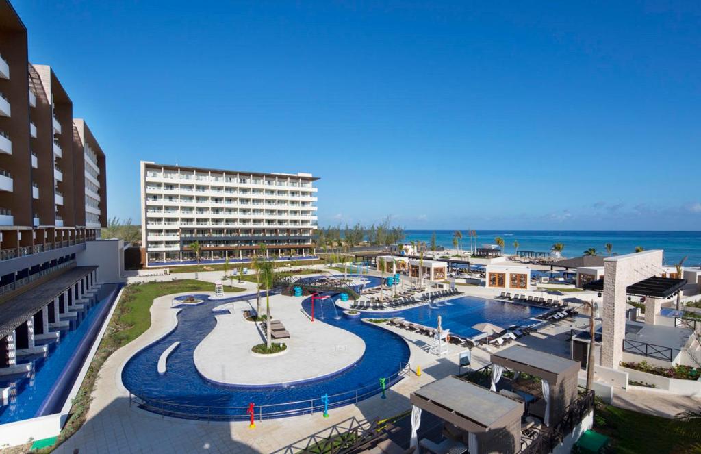 Royalton Blue Waters Montego Bay all-inclusive resort in Jamaica with overwater bungalows, family pools, and beachfront luxury amenities.