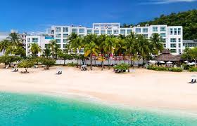 Sandals Montego Bay couples-only luxury all-inclusive resort in Jamaica with private beach, overwater bungalows, and tropical gardens.