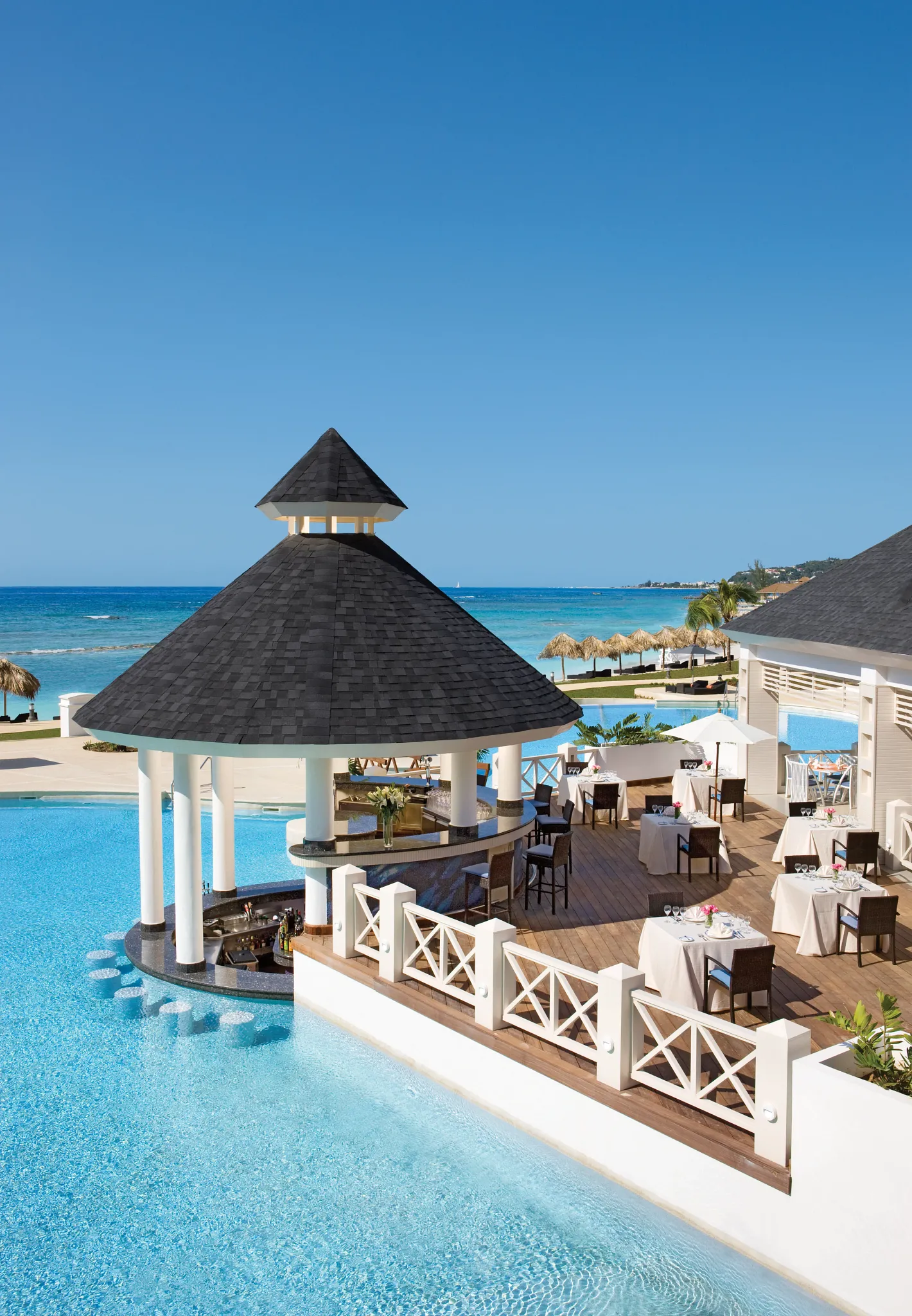 Seaside Grill at Secrets Wild Orchid Montego Bay featuring open-air oceanfront dining and grilled specialties by the pool.