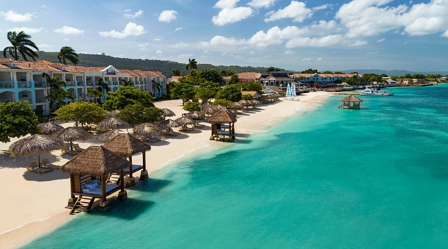 Secrets St. James Montego Bay adults-only all-inclusive resort featuring colonial-style architecture, romantic setting, and Caribbean Sea views.