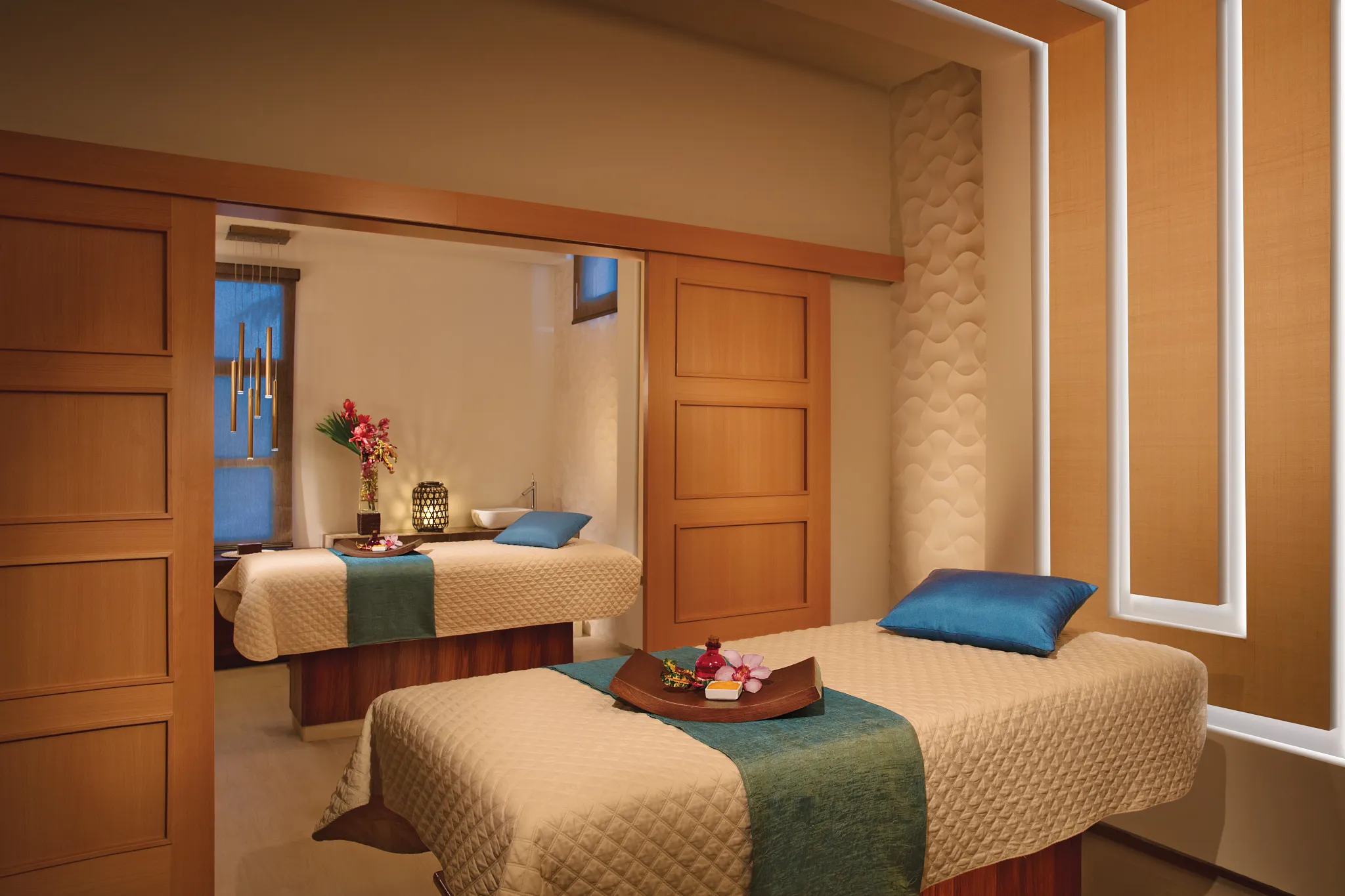 Couples massage room with dual treatment tables at Secrets Wild Orchid Montego Bay spa.