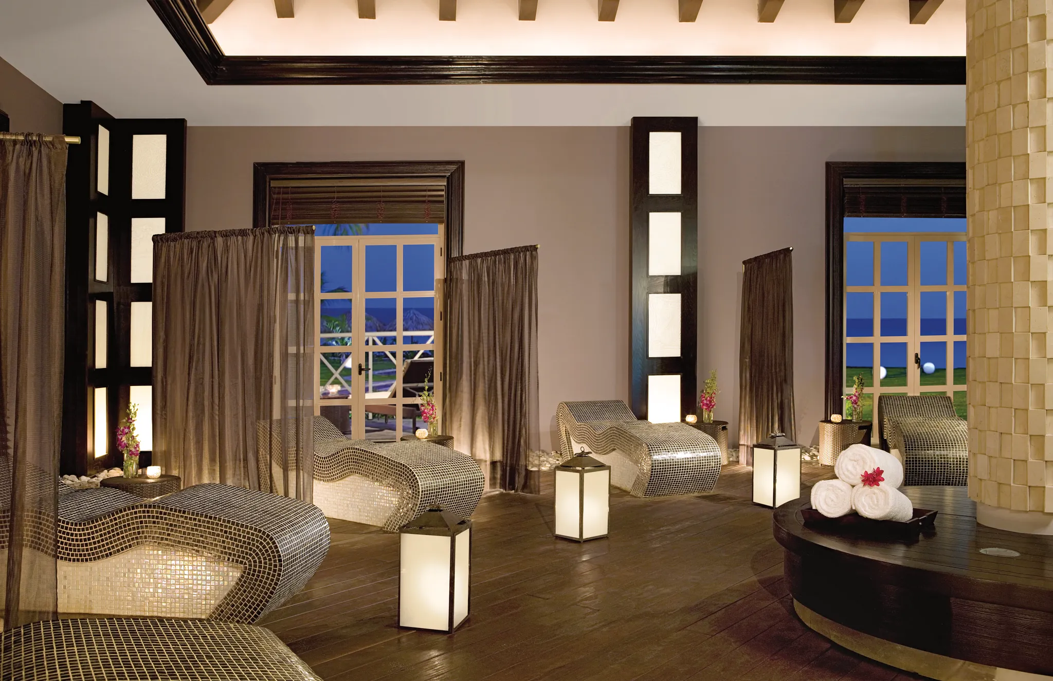 Elegant spa relaxation lounge with mosaic loungers at Secrets Wild Orchid Montego Bay.